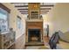 Living room with exposed beams, fireplace, and hardwood floors at 157 Line St, Charleston, SC 29403