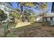 Large backyard with mature trees and a shed at 186 Sans Souci St, Charleston, SC 29403