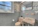 Retro bathroom with pink fixtures and patterned wallpaper at 186 Sans Souci St, Charleston, SC 29403