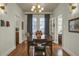 Bright dining room features hardwood floors and a mid-century modern table at 186 Sans Souci St, Charleston, SC 29403