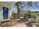 Relaxing front porch with seating and shade tree at 186 Sans Souci St, Charleston, SC 29403