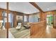 Living area with wood wall paneling and hardwood floors at 186 Sans Souci St, Charleston, SC 29403