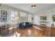 Spacious living room with hardwood floors, floral wallpaper and ample natural light at 186 Sans Souci St, Charleston, SC 29403