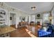 Charming living room features hardwood floors, floral wallpaper, and a cozy fireplace at 186 Sans Souci St, Charleston, SC 29403