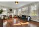 Bright living room with hardwood floors, fireplace, and large windows at 186 Sans Souci St, Charleston, SC 29403