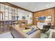 Living room with wood paneled walls and built-in shelving at 186 Sans Souci St, Charleston, SC 29403