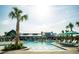 Relaxing pool area with palm trees and umbrellas at 191 Blueway Ave, Summerville, SC 29486