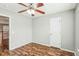 Bedroom with wood floors, ceiling fan and access to loft at 2005 Isabela Ct, Summerville, SC 29483