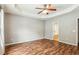 Bedroom with wood floors, ceiling fan and access to bath at 2005 Isabela Ct, Summerville, SC 29483