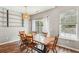 Dining room with a farmhouse table and hardwood floors at 2005 Isabela Ct, Summerville, SC 29483