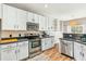 Modern kitchen with white cabinets, stainless steel appliances, and hardwood floors at 2005 Isabela Ct, Summerville, SC 29483