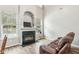 Living room with fireplace, hardwood floors, and brown leather couch at 2005 Isabela Ct, Summerville, SC 29483
