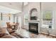 Open living space with fireplace, dining area, and hardwood floors at 2005 Isabela Ct, Summerville, SC 29483