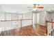 Open loft area with hardwood floors and ceiling fan at 2005 Isabela Ct, Summerville, SC 29483