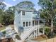 Two-story home with detached garage and fenced backyard at 3893 James Bay Rd, Johns Island, SC 29455