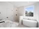 Spa-like bathroom with soaking tub, walk-in shower, and modern vanity at 3893 James Bay Rd, Johns Island, SC 29455
