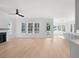 Open living space with hardwood floors and kitchen access at 3893 James Bay Rd, Johns Island, SC 29455