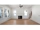 Living room with hardwood floors, fireplace, and built-in shelving at 3893 James Bay Rd, Johns Island, SC 29455