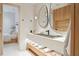 Modern bathroom with double vanity, large mirrors, and view of bedroom at 3 Chisolm St # 106, Charleston, SC 29401