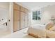 Bright bedroom with built-in light wood closet at 3 Chisolm St # 106, Charleston, SC 29401