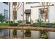 Peaceful courtyard with reflecting pool, and seating near building entrance at 3 Chisolm St # 106, Charleston, SC 29401