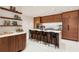 Modern kitchen with island and wood cabinetry at 3 Chisolm St # 106, Charleston, SC 29401