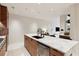 Modern kitchen island with marble countertop and sink at 3 Chisolm St # 106, Charleston, SC 29401