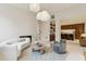 Open concept living room with kitchen and bar area at 3 Chisolm St # 106, Charleston, SC 29401