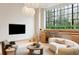 Modern living room with large window and TV at 3 Chisolm St # 106, Charleston, SC 29401