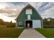 Green community barn with walkway and open doors at 312 Parish Farms Dr, Summerville, SC 29486