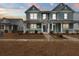 Two-story house with light teal siding, white trim, and a porch at 312 Parish Farms Dr, Summerville, SC 29486
