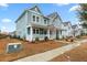 Two-story house with light teal siding, a porch, and landscaping at 312 Parish Farms Dr, Summerville, SC 29486