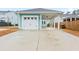 Attached garage with carport and concrete driveway at 312 Parish Farms Dr, Summerville, SC 29486