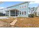 Two story house with screened porch and landscaped yard at 312 Parish Farms Dr, Summerville, SC 29486