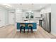 Kitchen with island, granite countertops, stainless steel appliances, and blue accent wall at 312 Parish Farms Dr, Summerville, SC 29486