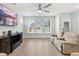 Spacious living room with large windows and ceiling fan at 312 Parish Farms Dr, Summerville, SC 29486