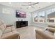 Spacious living room featuring a large TV and comfy sofas at 312 Parish Farms Dr, Summerville, SC 29486