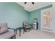 Screened porch with seating, small table and mini fridge at 312 Parish Farms Dr, Summerville, SC 29486