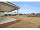 Covered patio overlooks a pond and neighboring homes at 333 Dahlia Row Dr, Summerville, SC 29486