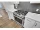 Stainless steel gas range and oven with white shaker cabinets at 333 Dahlia Row Dr, Summerville, SC 29486