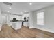 Open concept kitchen and living area with hardwood floors at 333 Dahlia Row Dr, Summerville, SC 29486