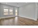 Living room with hardwood floors, windows, and door leading outside at 333 Dahlia Row Dr, Summerville, SC 29486