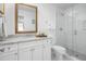 Clean bathroom with a large walk-in shower and granite vanity at 407 Yacht Harbor Ct, Isle of Palms, SC 29451