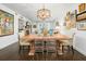 Bright dining area with a rustic wooden table and seating at 407 Yacht Harbor Ct, Isle of Palms, SC 29451