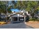 Condo building with attached garages and landscaping at 407 Yacht Harbor Ct, Isle of Palms, SC 29451