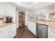 Open concept kitchen with white cabinets and stainless steel appliances at 407 Yacht Harbor Ct, Isle of Palms, SC 29451