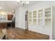 Spacious dining area with a farmhouse table, built-in cabinetry, and kitchen views at 4822 Cane Pole Ln, Summerville, SC 29485