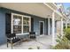 Inviting front porch with comfortable seating at 4822 Cane Pole Ln, Summerville, SC 29485