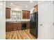 Kitchen with wood cabinets, stainless steel appliances and black refrigerator at 4822 Cane Pole Ln, Summerville, SC 29485
