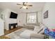 Living room featuring an L-shaped sofa and hardwood floors at 4822 Cane Pole Ln, Summerville, SC 29485